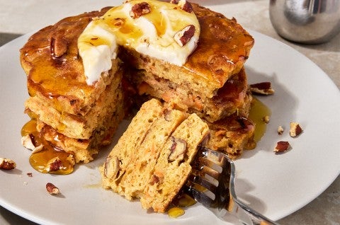Carrot Cake Pancakes on a plate with a slice taken out - select to zoom