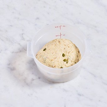 Multigrain Protein Bread dough in a bowl before rising.