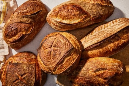 Multiple loaves of golden brown bread