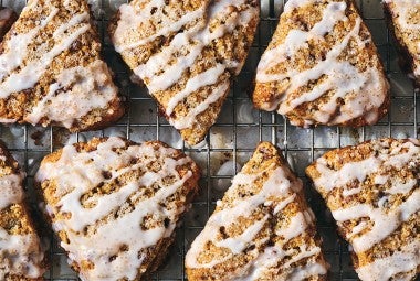 Cinnamon Whole Wheat Scones on a cooling rack, glazed